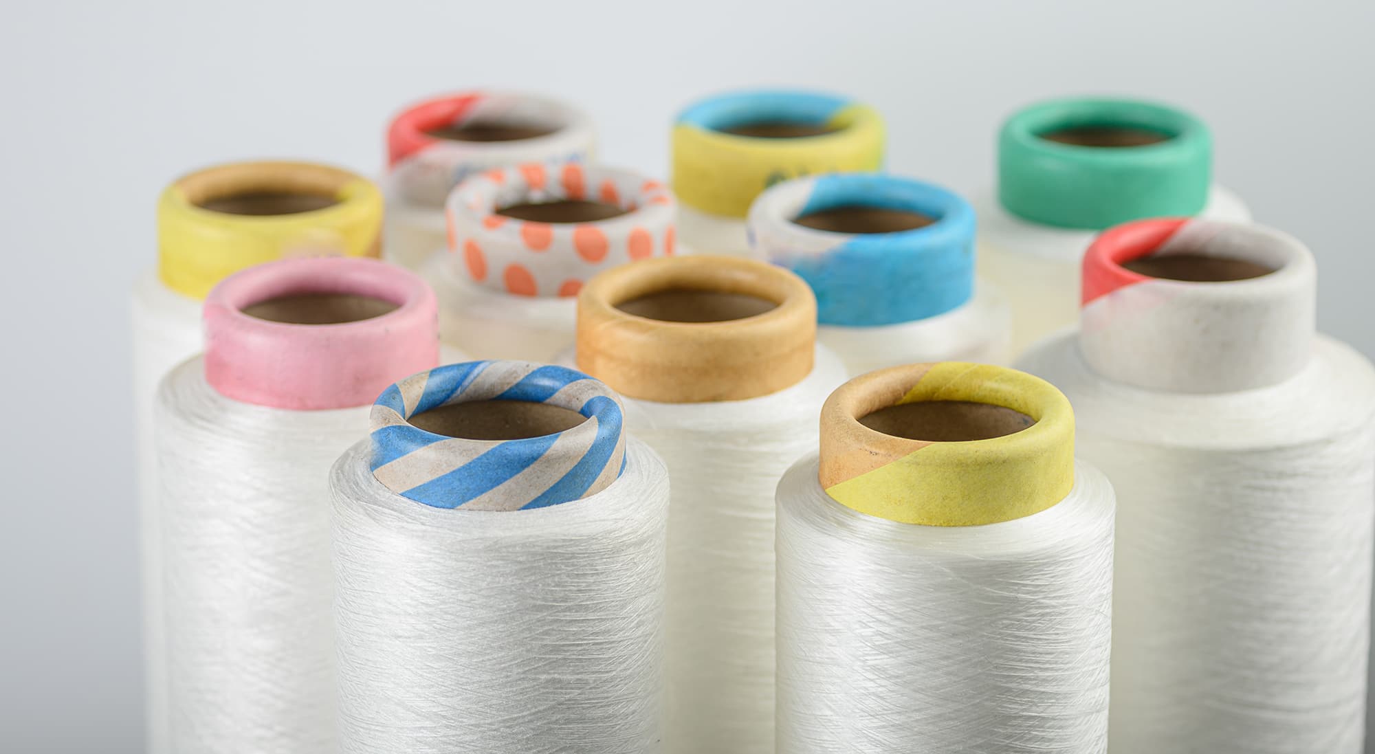 Colourful yarn cones in a textile mill